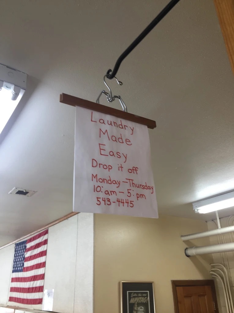 Drop-off laundry service sign inside the laundromat