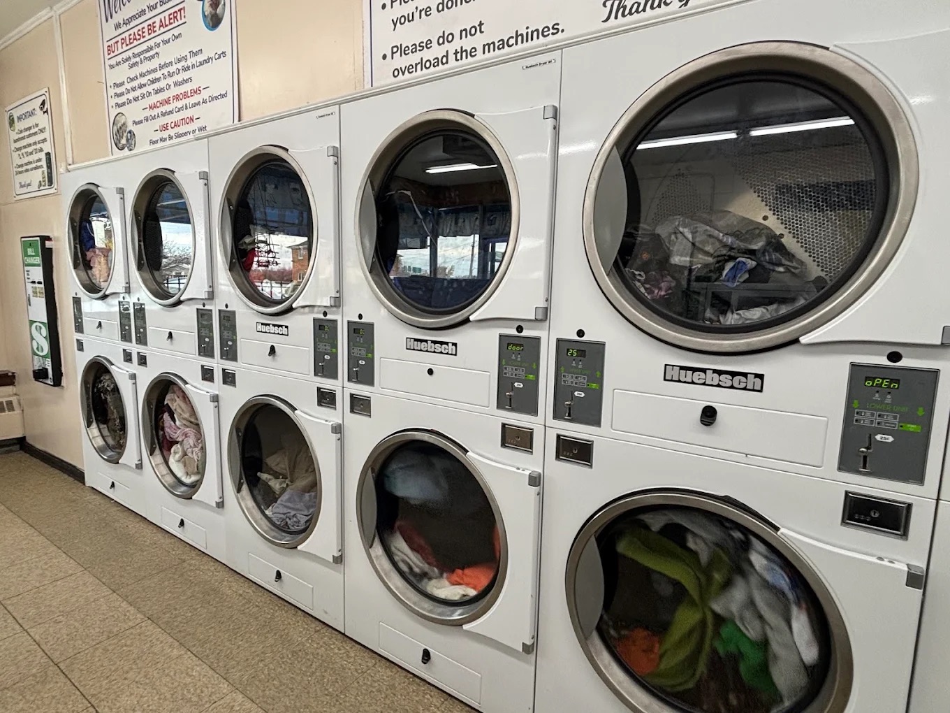 Wall of commercial dryers in the laundromat